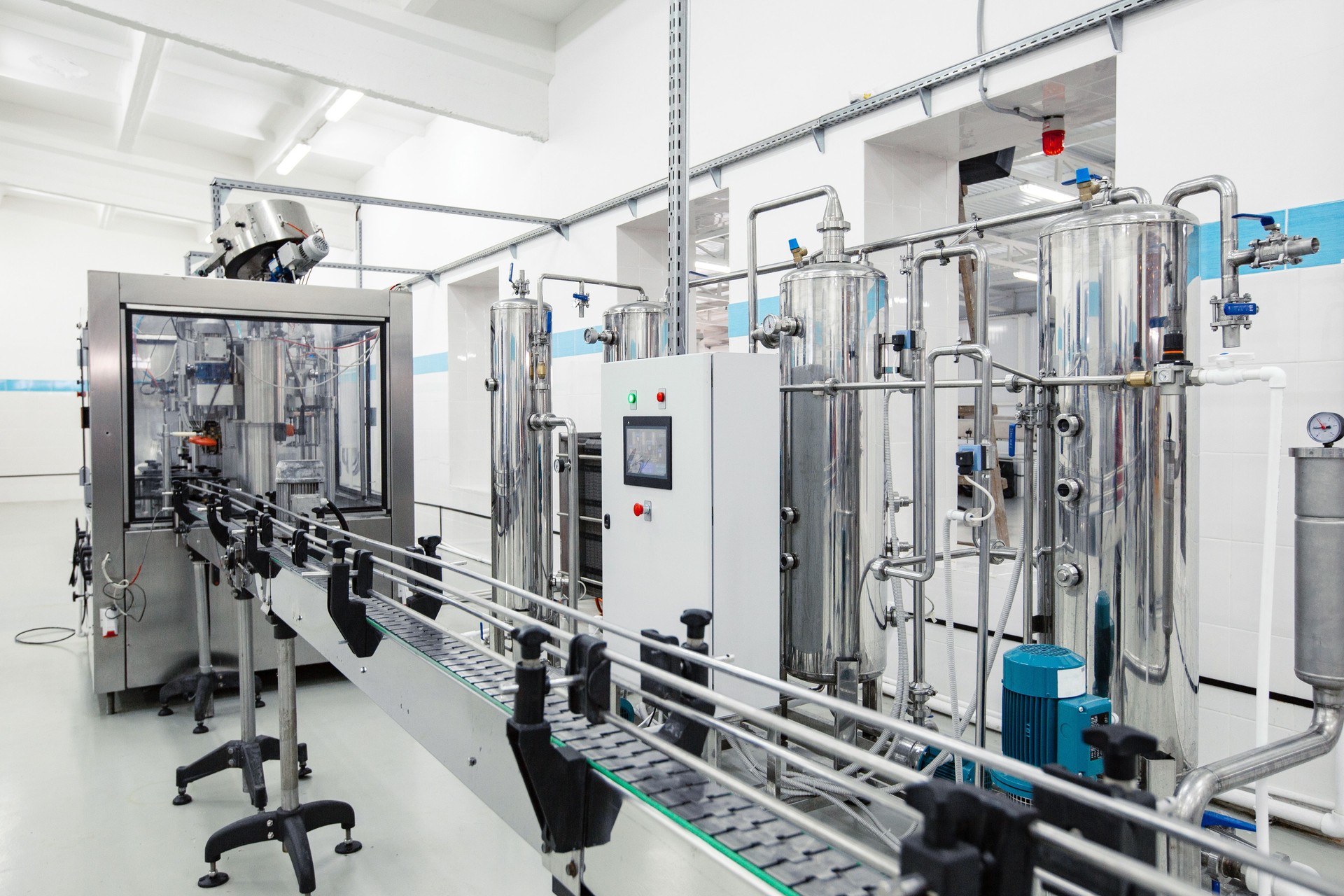 Modern processing line featuring stainless steel machinery in a clean factory environment
